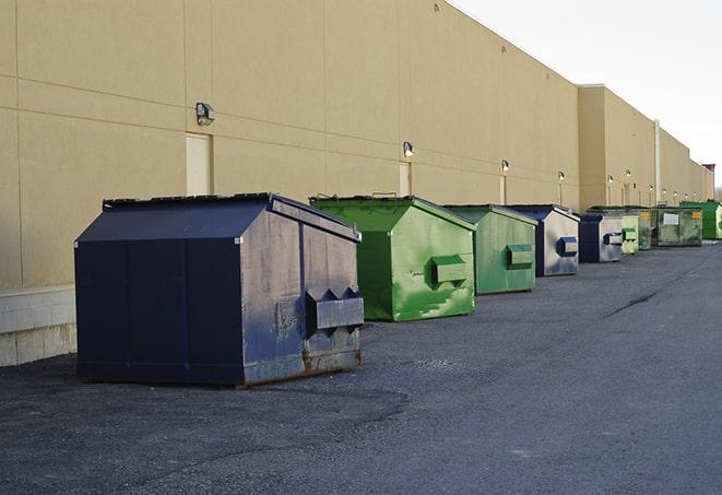 a crowd of dumpsters of all colors and sizes at a construction site in Elk Grove